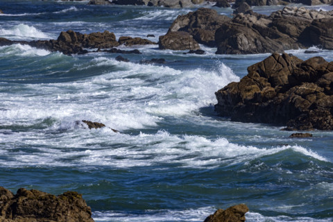 Ocean waves crashing against rocks at 17-Mile Drive
