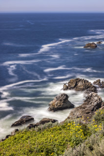 Water swirling around rocks, motion blur