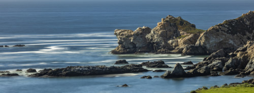 Water swirling around rocks, motion blur