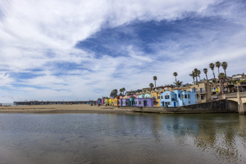 Colorful Venetian Court buildings and beach