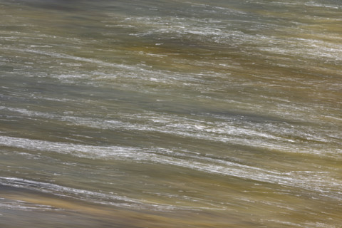 Close-up of pristine mountain creek water, motion blur