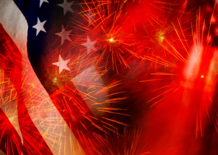 Close-up of American flags and fireworks. Washington, Washington DC, United States
