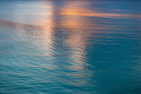 Sunlight reflected in calm water surface in morning. Boca Raton, Florida, United States