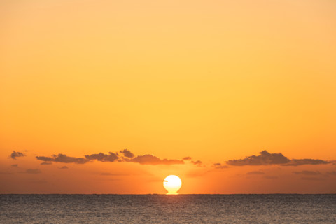Sun rising over calm ocean. Boca Raton, Florida, United States