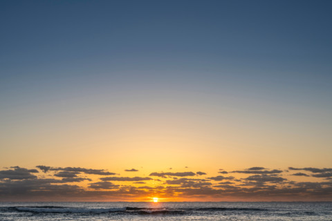 Sun rising over calm ocean. Boca Raton, Florida, United States