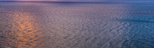 Calm ocean surface reflecting sunlight at sunrise. Boca Raton, Florida, United States