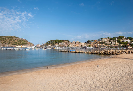 Sandy beach and old town buildings. Soller Port, Mallorca, Spain