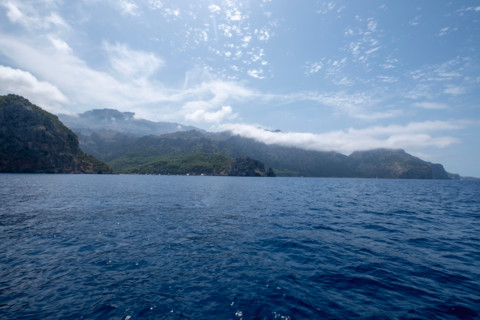 Calm sea and cliffs on sunny day. , Mallorca, Spain