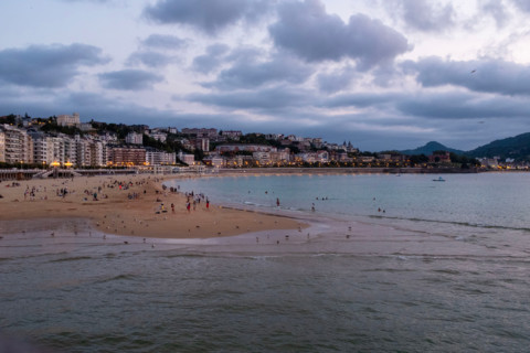 Tourists at Concha Beach at sunset. San Sebastian, Gipuzkoa, Spain