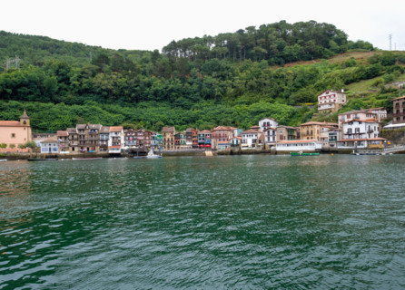 Fishing village seen across calm water. Pasaia, Gipuzkoa, Spain