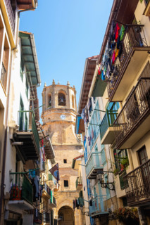 Townhouses and San Salvador church tower. Getaria, Gipuzkoa, Spain