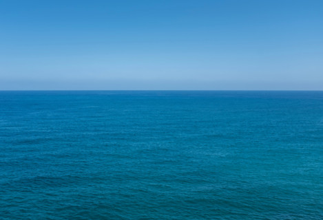 Clear blue sky over calm Bay of Biscay. Zumaia, Gipuzkoa, Spain