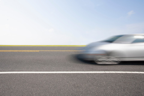 Silver sports car in motion. Chincoteague, Virginia, United States