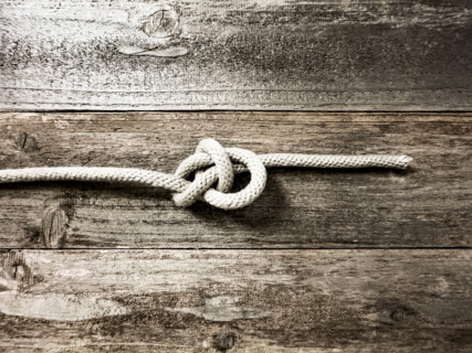 Bow line knot on wooden surface. Nantucket, Massachusetts, United States