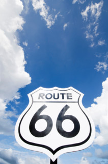 Low angle view of Route 66 sign against sky. Williams, Arizona, United States