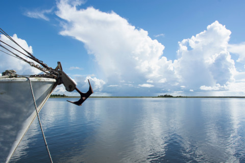 Fishing boat bow on calm Apalachicola River. Apalachicola, Florida, United States