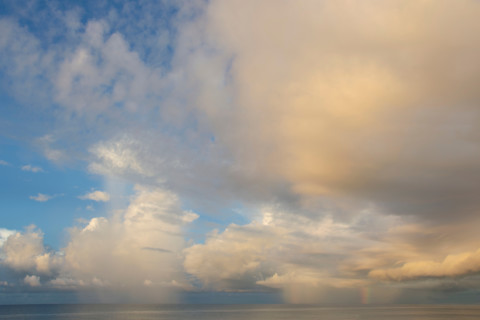 Clouds over calm gulf at sunset. St. George Island, Florida, United States