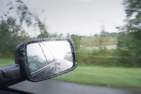 Close-up of truck side mirror in rain storm. Port St. Joe, Florida, United States
