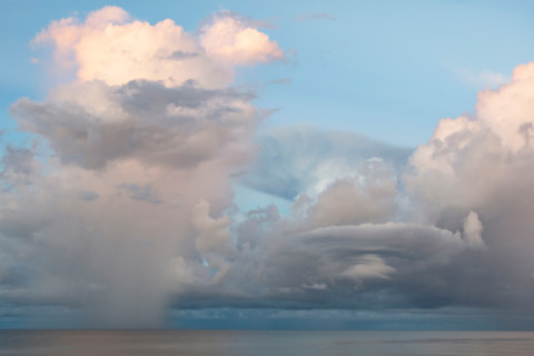 Storm clouds over calm Gulf of Mexico. St. George Island, Florida, United States