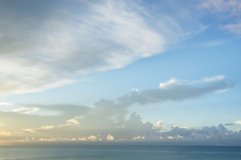Wispy clouds at sunrise over calm Gulf of Mexico. St. George Island, Florida, United States