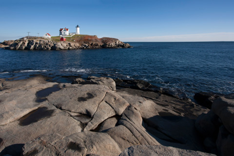 Rocky coast and Nubble Lighthouse. York, Maine, United States
