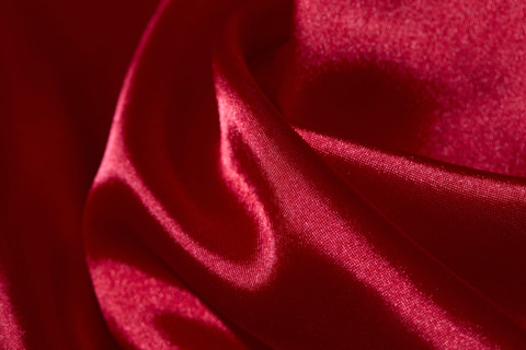 Close-up of folded red silk. New york City, New York State, United States