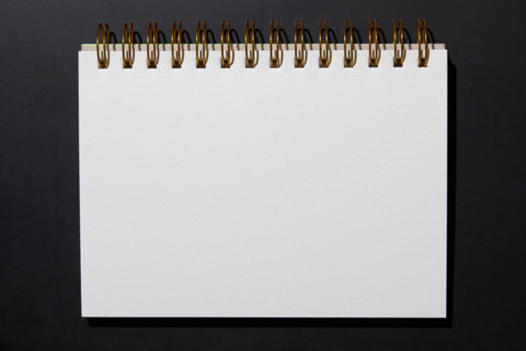 Blank notebook on black background. New york City, New York State, United States