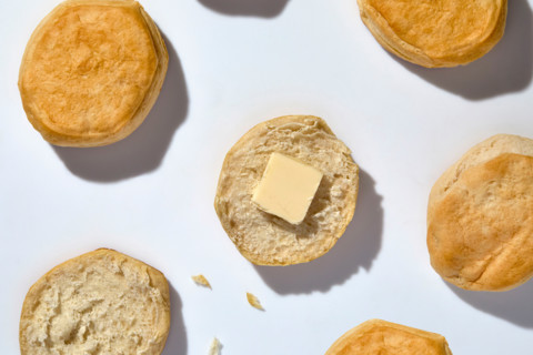 Crossed buns with piece of butter on white background. New york City, New York State, United States