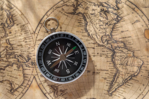 Compass on top of vintage world map. New york City, New York State, United States