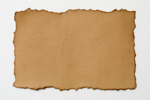 Torn vintage paper on white background. New York City, New York State, United States
