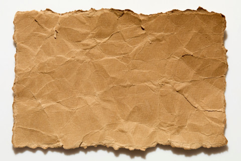 Torn wrinkled paper on white background. New York City, New York State, United States