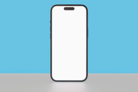 Blank smartphone on blue background. New York City, New York State, United States
