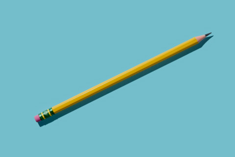 Yellow pencil on blue background. New York City, New York State, United States