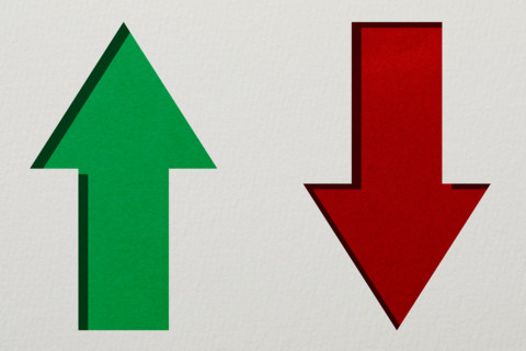 Red and green arrows on white textured background. New York City, New York State, United States