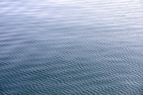 Full frame of calm rippled sea surface. Kodiak, Alaska, United States