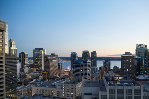 Downtown buildings illuminated at dusk. Seattle, Washington, United States