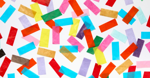 Colorful confetti on white background. New York City, New York State, United States