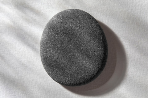 Stone on white textured background. New York City, New York State, United States