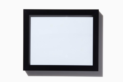 Black picture frame on white background. New York City, New York State, United States