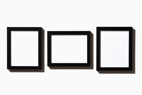 Three black picture frames on white background. New York City, New York State, United States