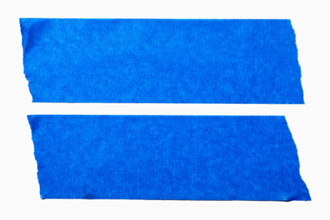 Blue painters tape on white background. New York City, New York State, United States