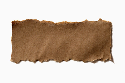 Torn craft paper on white background. New York City, New York State, United States