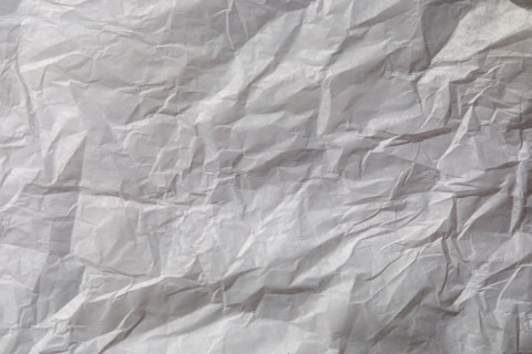 Close-up of white wrinkled paper. New York City, New York State, United States
