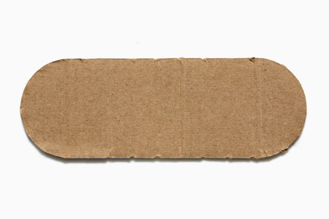 Rounded piece of cardboard on white background. New York City, New York State, United States