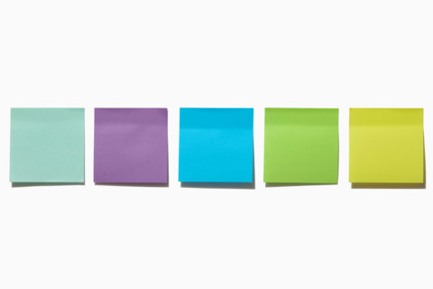 Row of blank colorful post it notes on white background. New York City, New York State, United