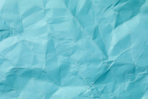 Close-up of wrinkled blue paper. New York City, New York State, United States