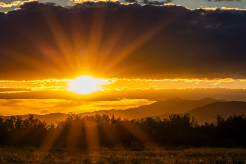 God rays over landscape at sunset. Bellevue, Idaho, United States