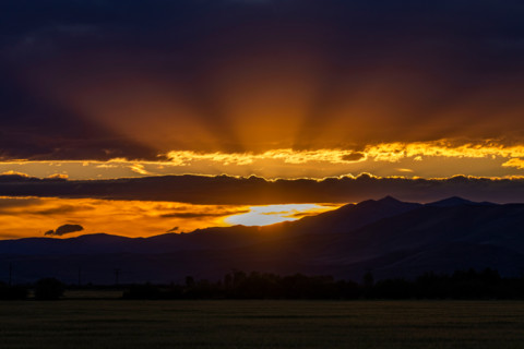 God rays over landscape at sunset. Bellevue, Idaho, United States