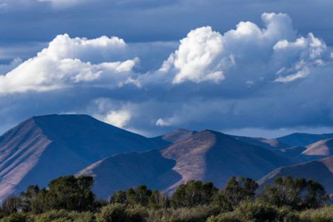 White puffy clouds above hills. Bellevue, Idaho, United States