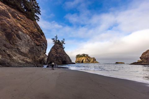 Woman on beach along Oregon Coast. Gold Beach, Oregon, United States